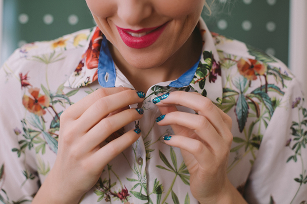 Woman Buttoning Her Shirt